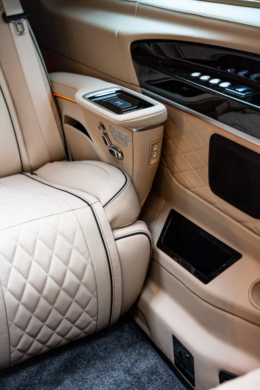 Luxury Car Interior by Swift Luxury Travel Elegant luxury car interior with plush leather seats and advanced controls.