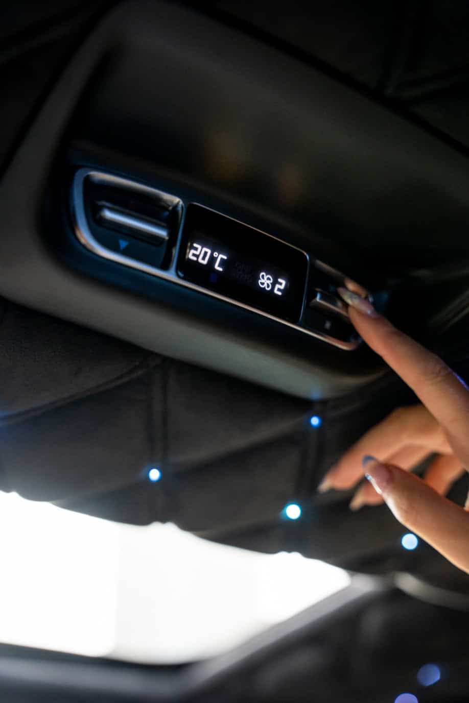 Swift Luxury Travel-03 Car climate control panel showing 20°C temperature setting and fan speed.