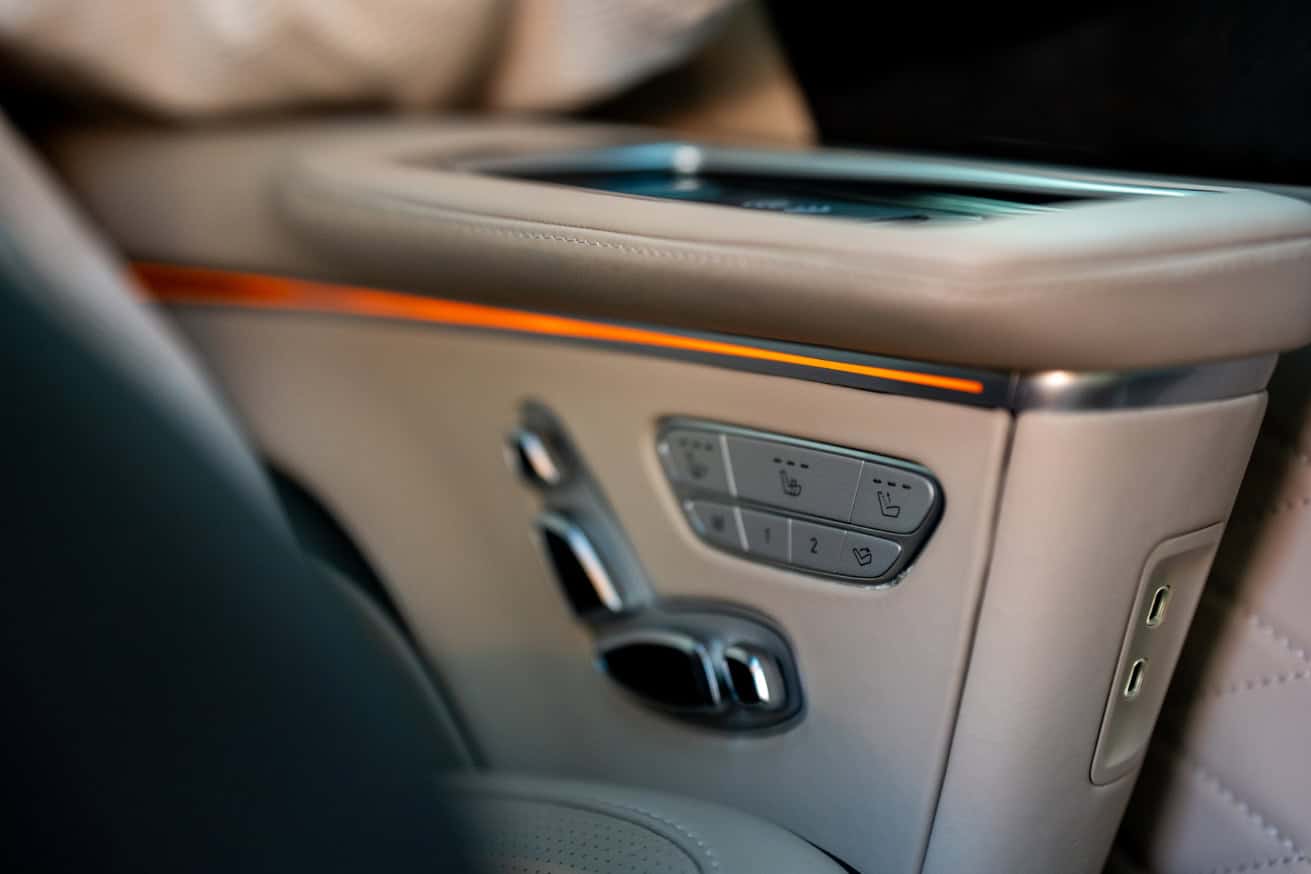 Swift Luxury Travel-52 Luxury car interior with control panel and touchscreen display.
